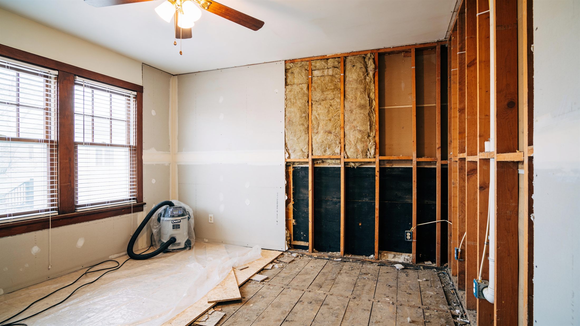 A neat flood cut with exposed studs during controlled demolition