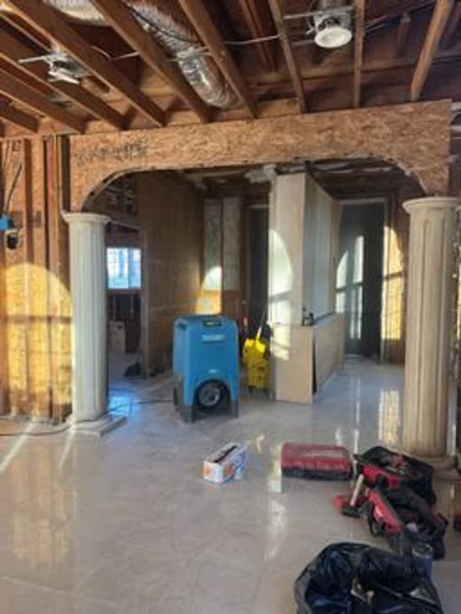 Ceiling opened to the joists, air movers running underneath